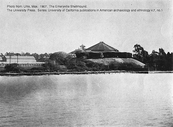 1902 photo, published 1907, of the Emeryville Shellmound with the historic shellmound park dance pavilion built on top. The shoreline of the San Francisco 