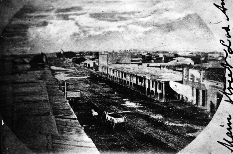 Temple Block adobe buildings on Main Street in Los Angeles in 1868.