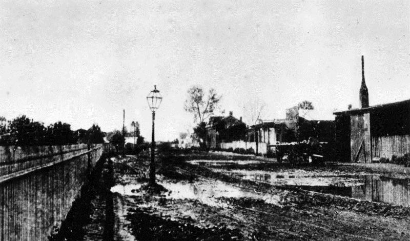 San Pedro Street, (Los Angeles?) a muddy dirt street near 2nd Street in the early 1870s.