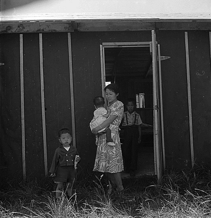 Family in front of barracks, May 19, 1942, Stockton Assembly Center, California. Courtesy of the National Archives and Records Administration. Photograph by Dorothea Lange.