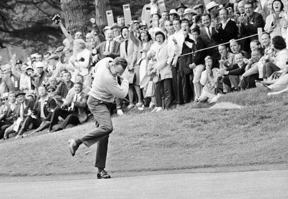 Billy Casper reacts after running a 25-foot putt into the cup at the U.S. Open (1966).