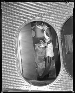 Transcontinental Air Transport flight attendant serves tea (1929).